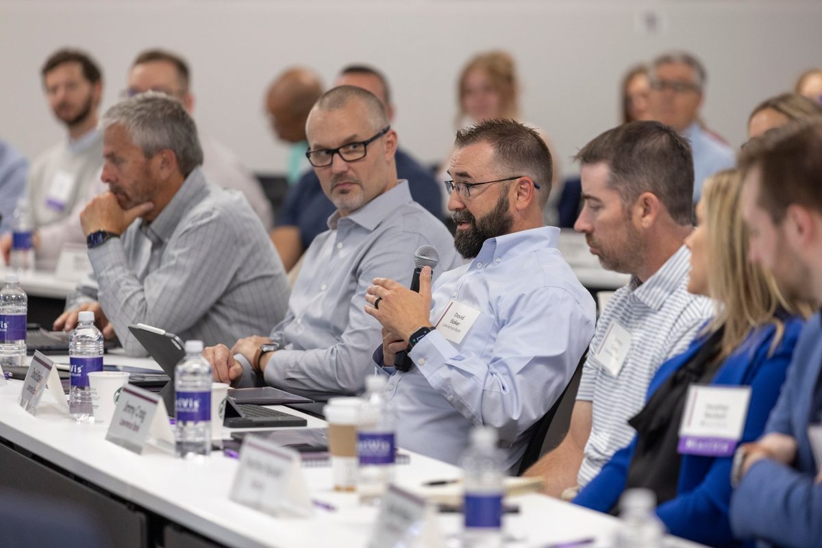 Attendees of the KlariVis Data & AI C-Suite Summit asking questions.